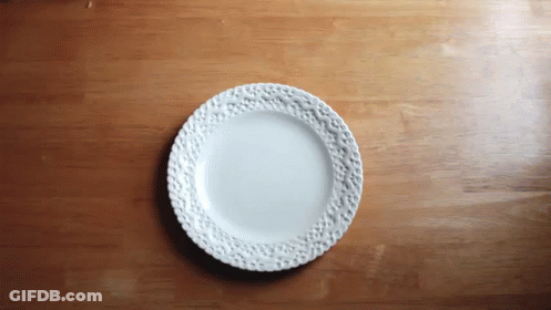 Floral White Plate On Wooden Table GIF