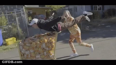 Flying Man And Woman Pushing Money Cart GIF
