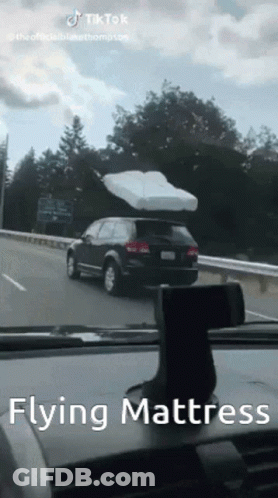 Flying Mattress On Car Highway GIF
