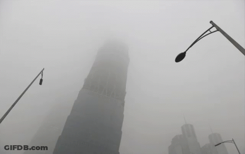 Foggy City With Very Tall Building GIF
