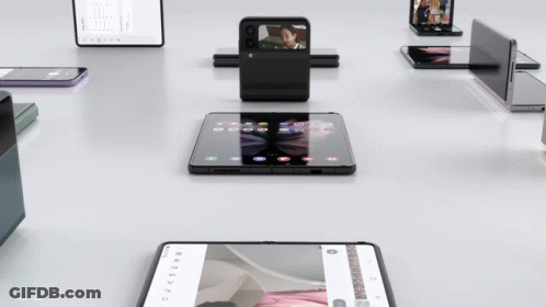 Folding Phones With Woman On Screen GIF