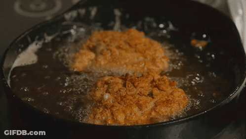 Food Being Cooked In Frying Pan With Bubbles GIF