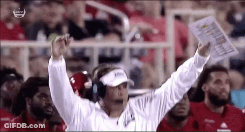 Football Coach Holding Paper With Visor GIF