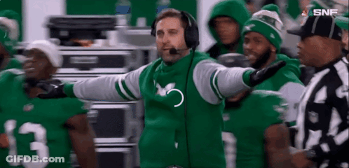 Football Coach In Headphones And Green Jacket GIF