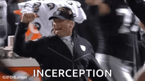 Football Coach Raising Fist With Crowd Cheering GIF