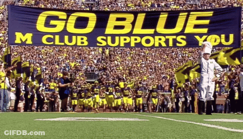 Football Field With Go Blue M Club Supports You Banner GIF