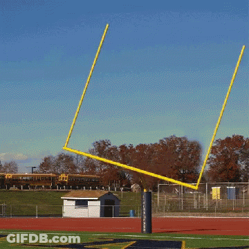 Football Field With Yellow Goal Post And White Shed GIF