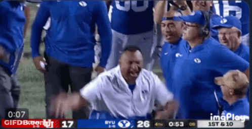 Football Game Between Utah And BYU On Screen GIF