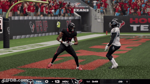 Football Game In Front Of Exans Banner GIF