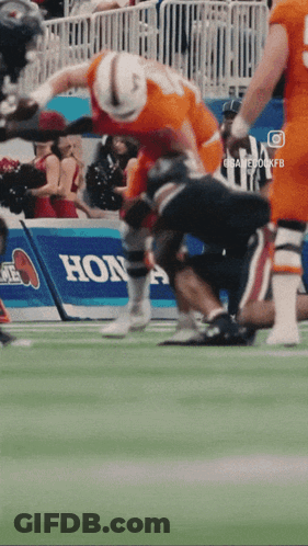 Football Game In Front Of Honda Banner GIF