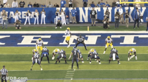 Football Game In Front Of Kentucky Sign GIF