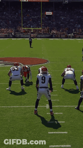 Football Game In Front Of Meijer Screen GIF