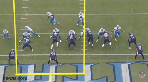 Football Game In Front Of Titans Logo GIF