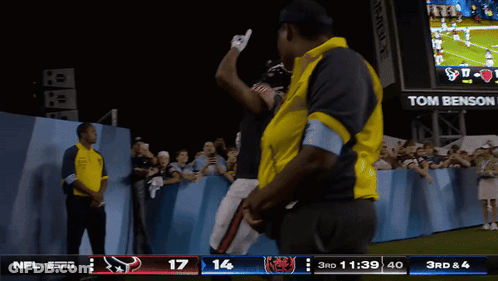 Football Game In Front Of Tom Benson Scoreboard GIF
