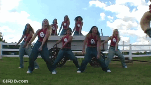 Football Game In Front Of Wendy's Sign GIF