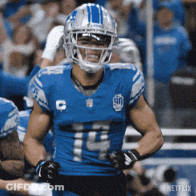 Football Game In Front Of Xfinity Sign GIF