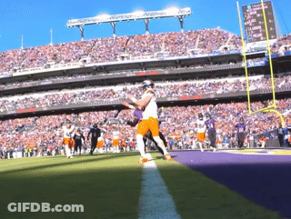 Football Game In Stadium With Reebok Scoreboard GIF