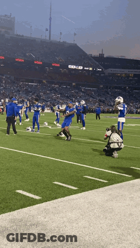 Football Game In Stadium With Verizon Sign GIF