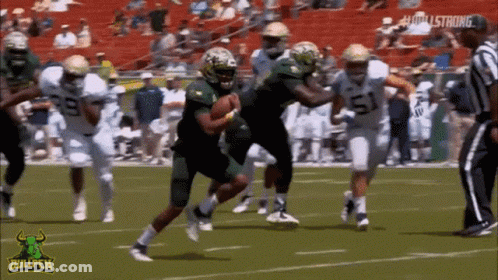 Football Game With Bullpen Logo On Sidelines GIF