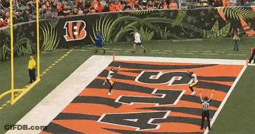 Football Game With Large B On Wall GIF