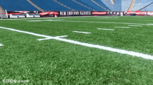 Football On Field With Patriots Banner GIF