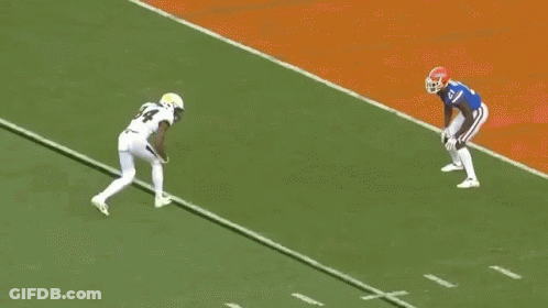 Football Player 77 Tackled By Player 92 GIF