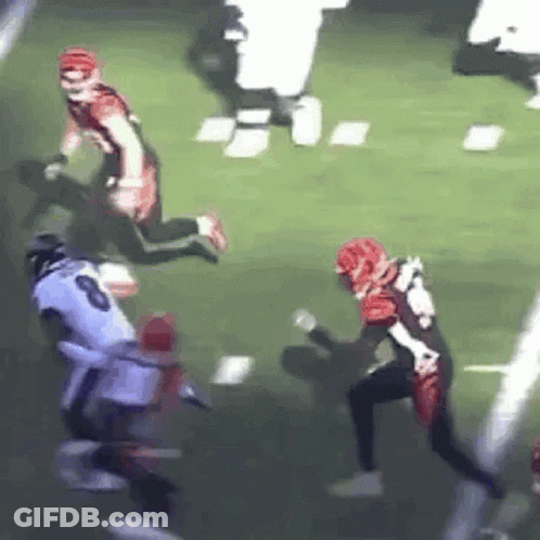 Football Player Being Tackled GIF