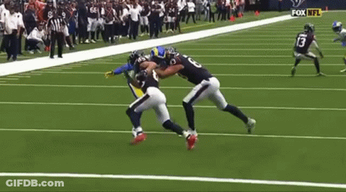 Football Player Being Tackled GIF