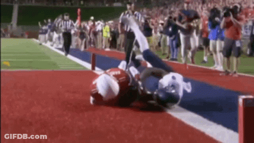 Football Player Being Tackled GIF
