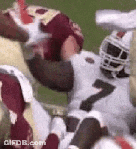 Football Player Being Tackled GIF