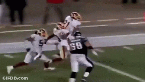 Football Player Being Tackled GIF