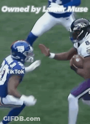 Football Player Being Tackled While Holding Ball GIF