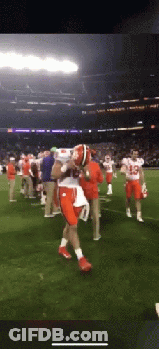 Football Player Carrying Football On Shoulders GIF