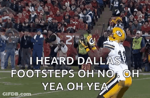 Football Player Catching Ball On Field With Crowd GIF