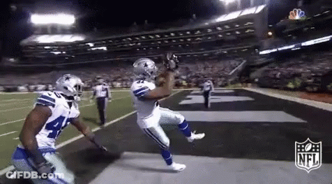 Football Player Catching Ball Teammate Watching GIF