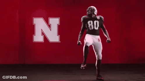 Football Player Dancing In Red Background With Letter N GIF