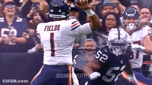 Football Player Fields Throwing Ball GIF