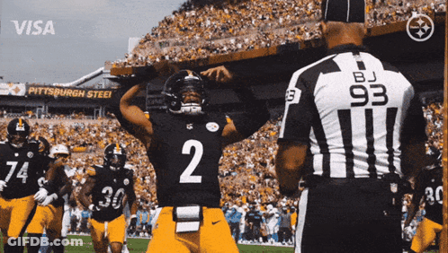 Football Player Fields Throwing Ball GIF
