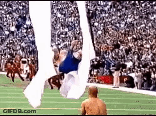 Football Player Flying Through Air GIF