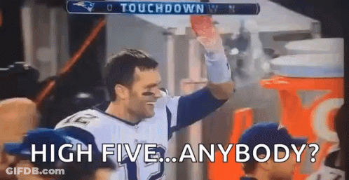 Football Player Holding Football High Fiving Crowd GIF