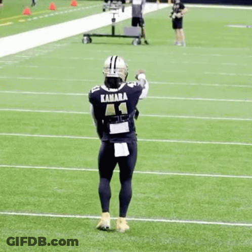 Football Player Holding Helmet GIF