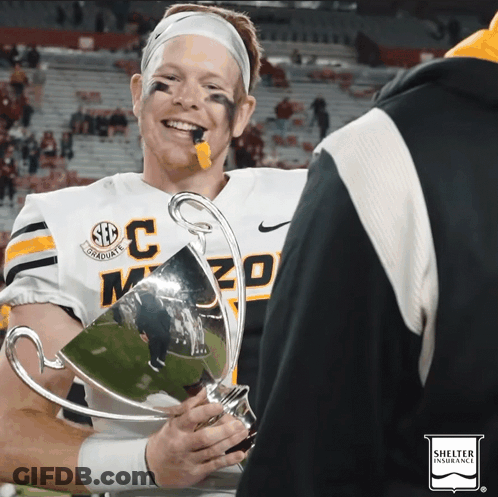 Football Player Holding Trophy With SEC GIF