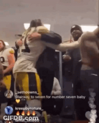 Football Player Hugging Another Player Saying Stairway To Seven GIF