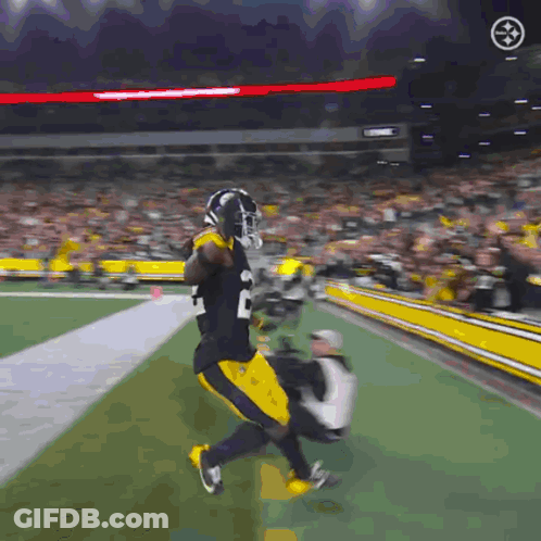 Football Player In Black And Yellow Uniform Number 20 GIF