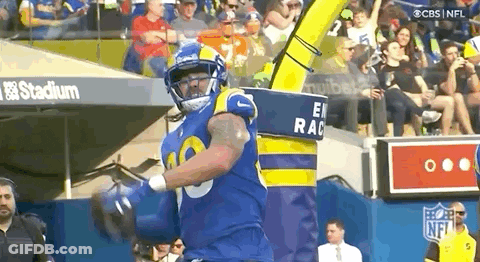 Football Player In Blue And Yellow Uniform Running With Ball GIF
