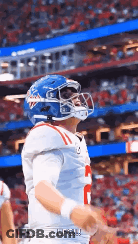 Football Player In Blue Helmet And White Jersey GIF