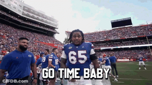 Football Player In Blue Jersey Number 65 GIF
