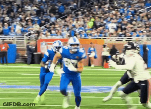 Football Player In Blue Uniform Running With Ball GIF