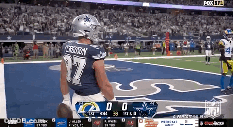 Football Player In Cowboys Uniform Standing On Field GIF