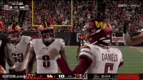 Football Player In Daniels Jersey Talking To Another GIF